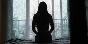 silhouette of a woman sitting