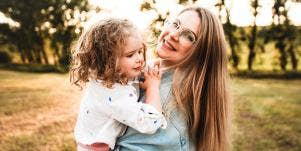 woman and daughter embracing