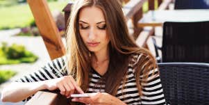 woman texting on phone