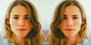 young dark-blonde woman looks intently into the camera