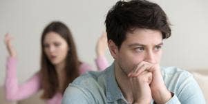 arguing couple sitting apart
