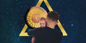 man holding a baby, aries zodiac symbolism