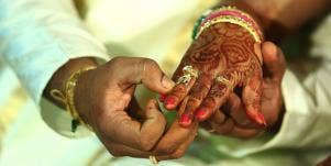couple holding hands at indian wedding