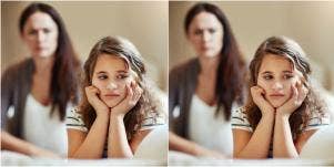sad little girl with mom behind her