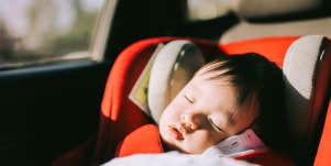 Baby sleeping in car seat in car