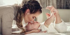 woman kissing baby