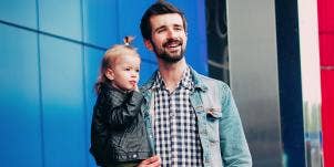 husband holding baby