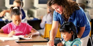 teacher helping a student
