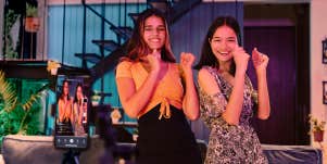 women filming their dance on phone