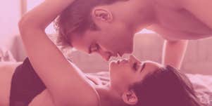 couple about to kiss in bed