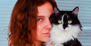 woman holding a cat