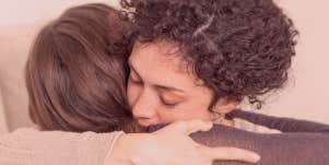 two woman hugging each other