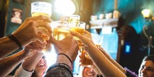 friends with beer in the air