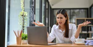 woman surprised by email at work