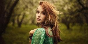woman in the forest looking back