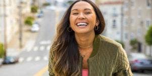 Woman smiling in cityscape