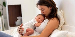 mom holding newborn baby
