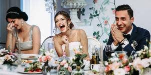 bride sitting at wedding table