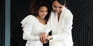 Brides cutting wedding cake