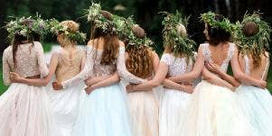 bridesmaids in a group taking a photo