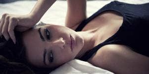 woman with ptsd from a relationship lying down