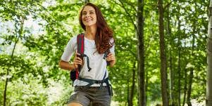 older woman hiking in the forest