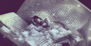 person sleeping in a book