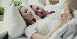 man and woman wearing white in bed