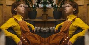 woman sitting in overalls