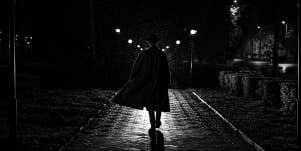 dark figure walking away