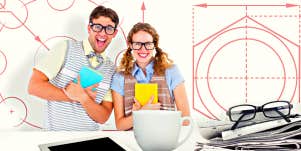 geeky hipster couple holding books and smiling at camera against blueprint