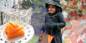 Little girl dressed as a witch, green from the carrots in front of her