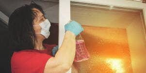 woman cleaning window