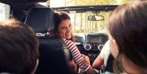 woman in the car with kids