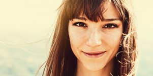 Portrait of confident, young woman looking at camera.