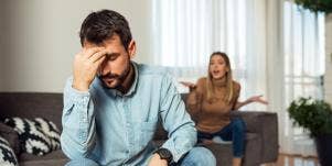young couple arguing in house