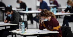 girl with mask at desk