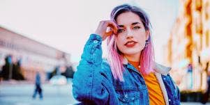 smiling pink-haired woman