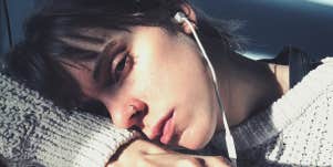 sad woman crying listening to music