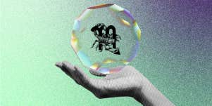 hand holding crystal with scorpio zodiac sign symbols