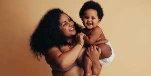 plus size mom holding baby