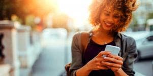 girl smiling while texting