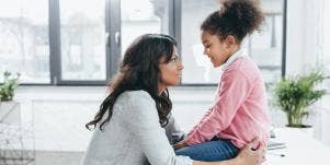 mom consoling daughter