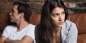 woman looking away from man who looks annoyed