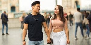 man and woman holding hands 