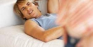 man daydreaming on couch