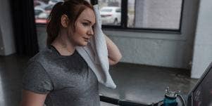 woman sweating on a treadmill