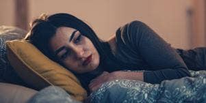 woman in bed thinking