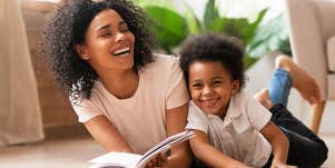 Mother and child reading on the floor