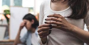 woman touching her wedding band